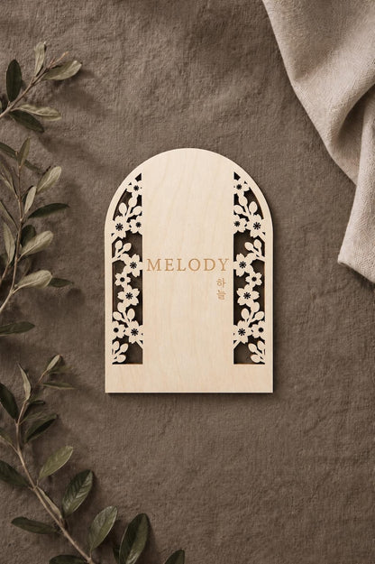 Cherry blossom cutout sign with English and Korean engraving