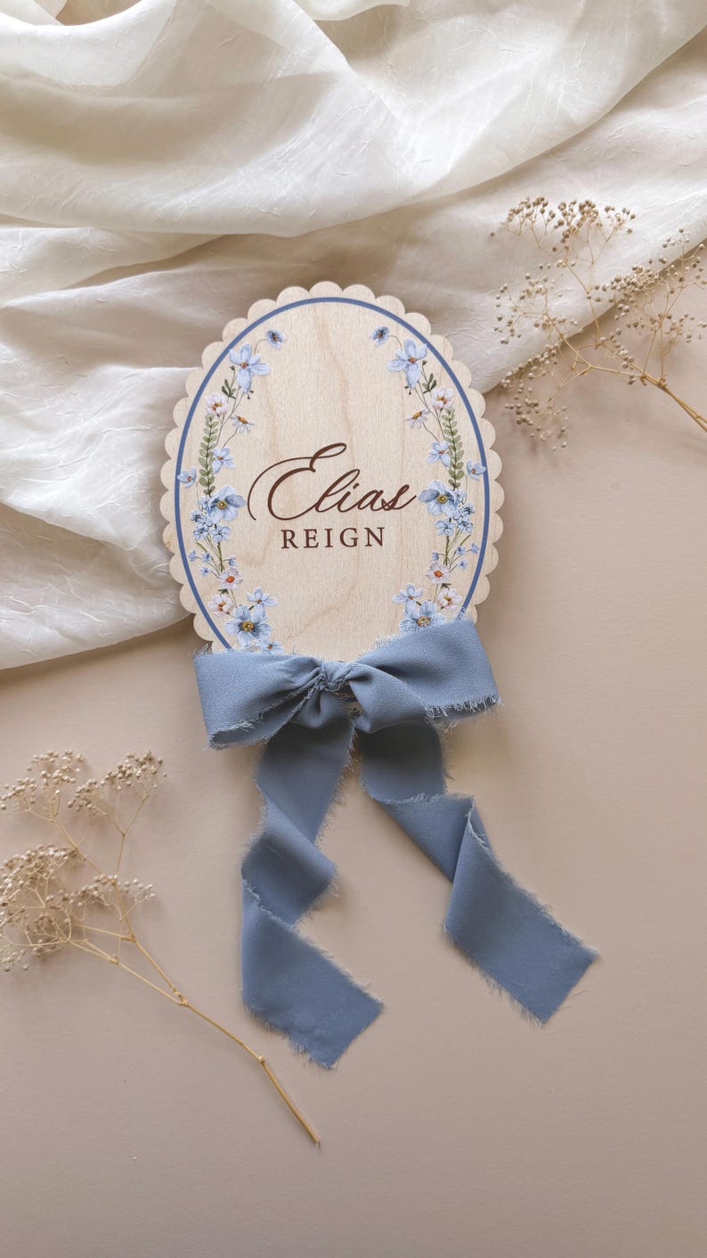 Blue wreath sign with dusty blue chiffon ribbon