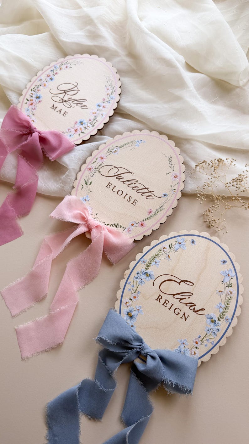 Three floral wreath styles on personalized name signs